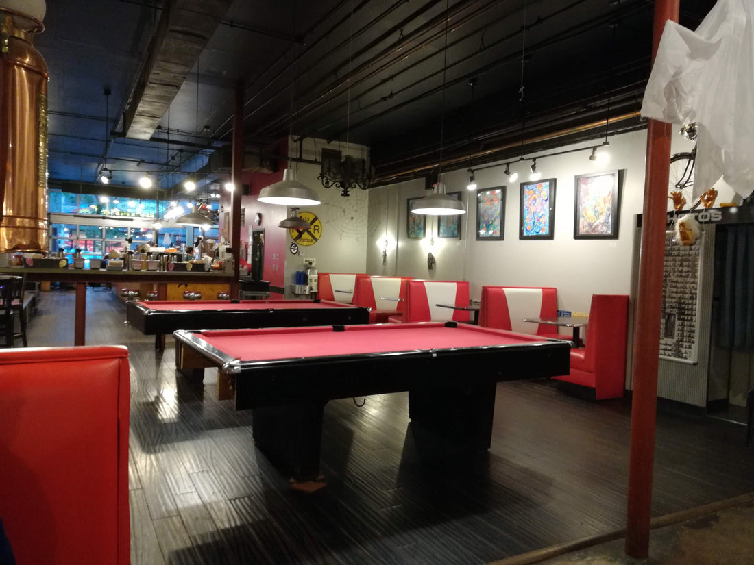 Pool table in a room, illustrating how table size affects space and cue clearance