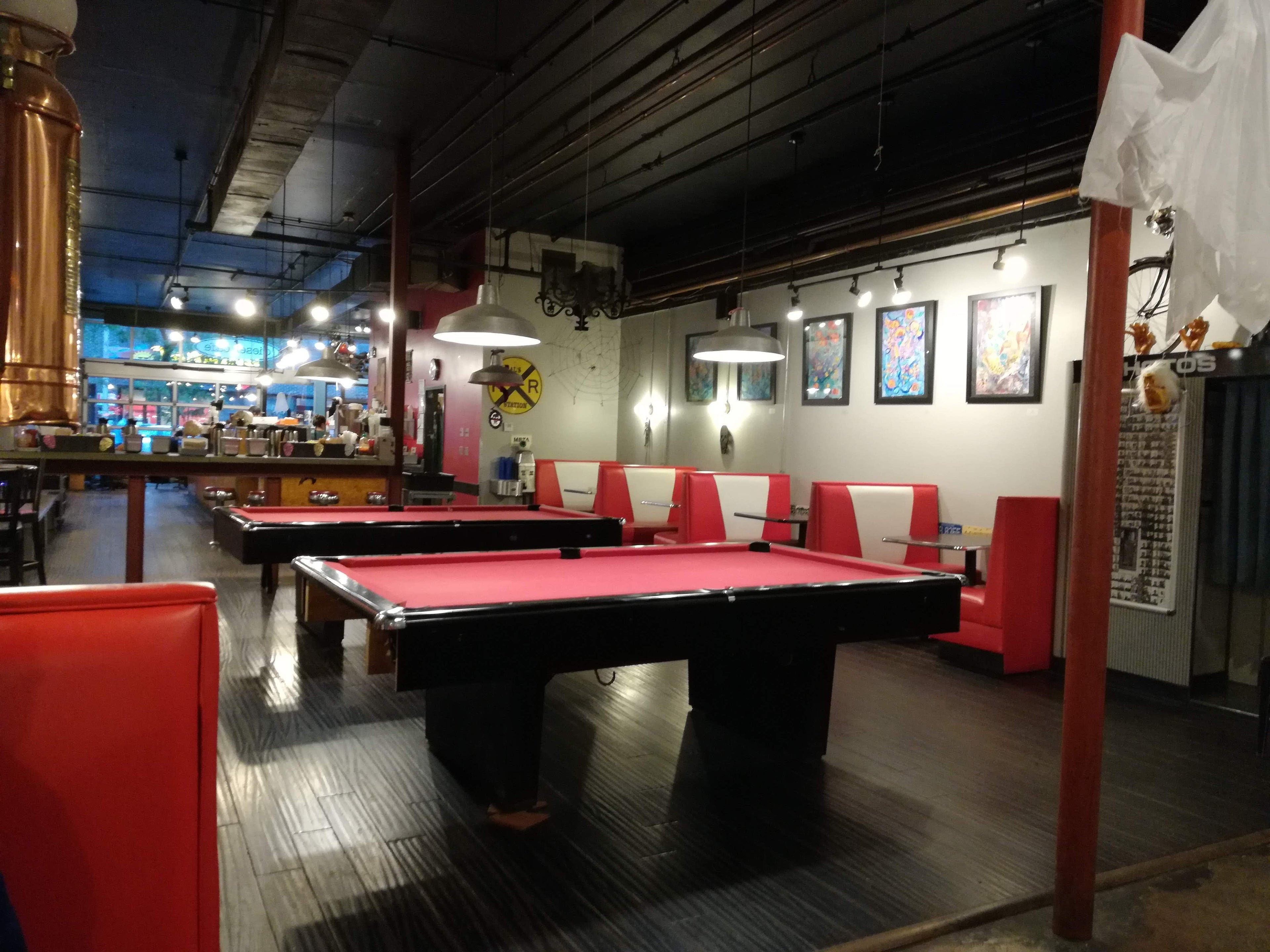 Pool table in a room, illustrating how table size affects space and cue clearance