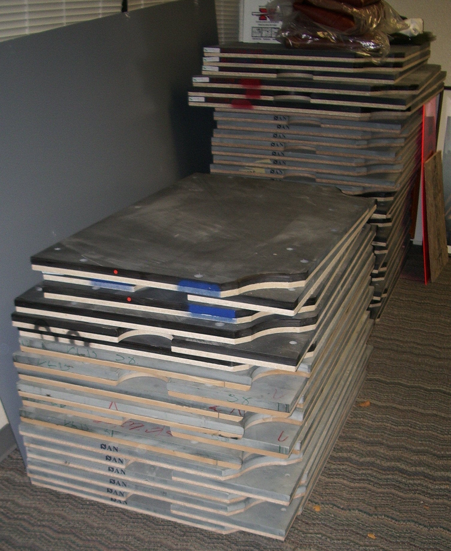 Stacks of pool table slate pieces used in billiard table construction
